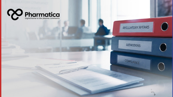 Pharmatica image of a modern pharmaceutical regulatory affairs workspace representing documentation, compliance, and submission processes essential for FDA drug approval. The scene shows three binders labeled &ldquo;Regulatory Affairs,&rdquo; &ldquo;Submissions,&rdquo; and &ldquo;Compliance&rdquo; on a clean office desk with documents and a pen in the foreground, while a blurred meeting of professionals is visible through a glass wall in the background. The composition conveys administrative precision and regulatory science underpinning.